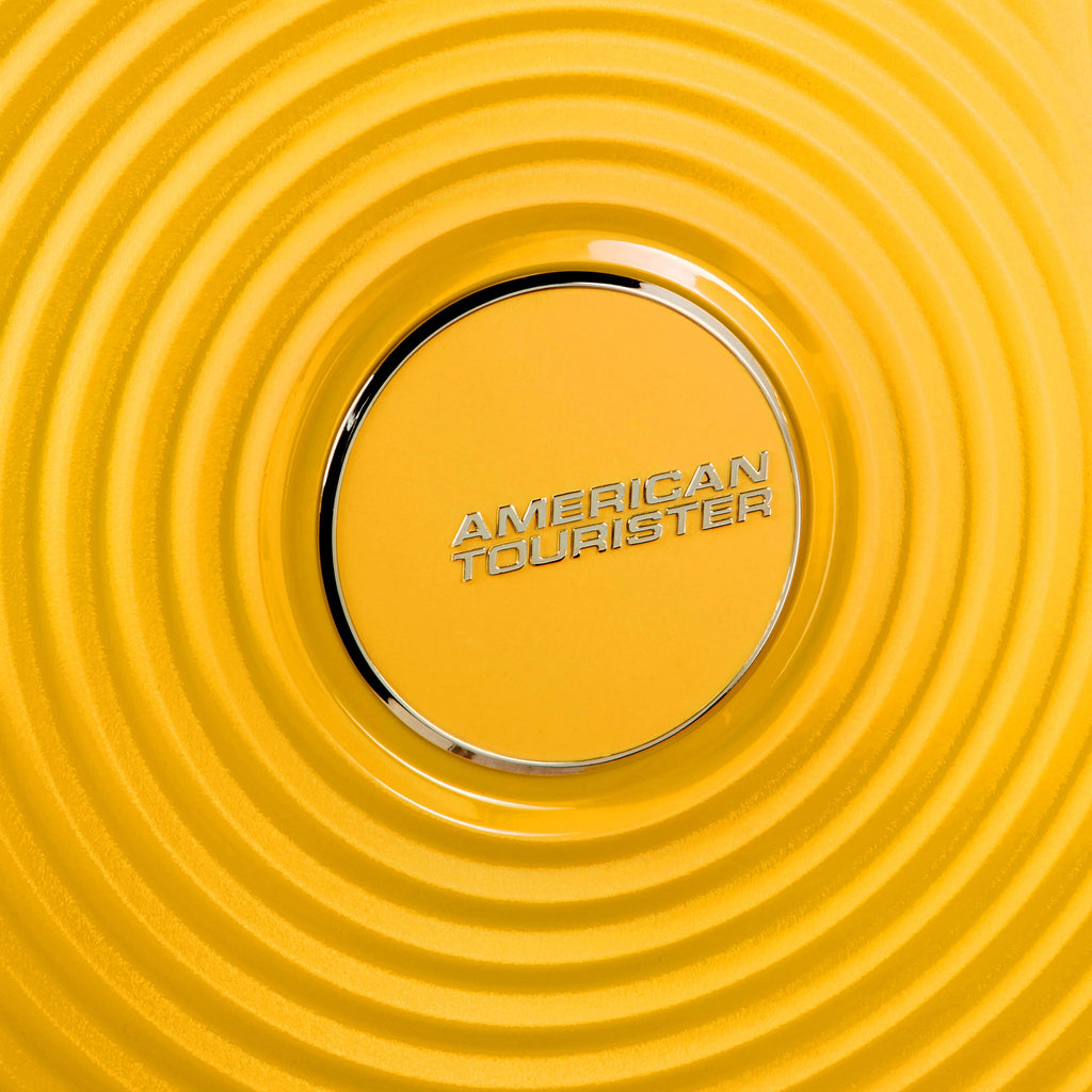 American Tourister Curio Spinner Carry-On™ in the color Golden Yellow.