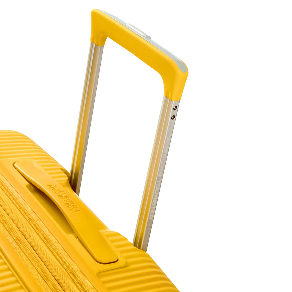 American Tourister Curio Spinner Medium in the color Golden Yellow.