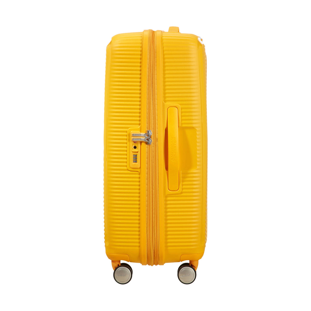 American Tourister Curio Spinner Medium in the color Golden Yellow.